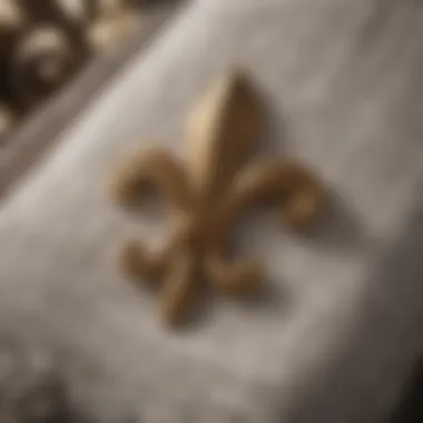 Close-up of intricate fleur de lis design on towels