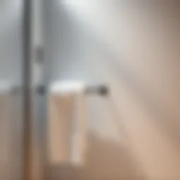 Sleek wall-mounted towel holder in a compact bathroom setting