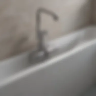 Installation of a stainless steel drain assembly in a modern bathtub