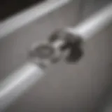 Detailed view of a stainless steel bathtub drain assembly highlighting its components